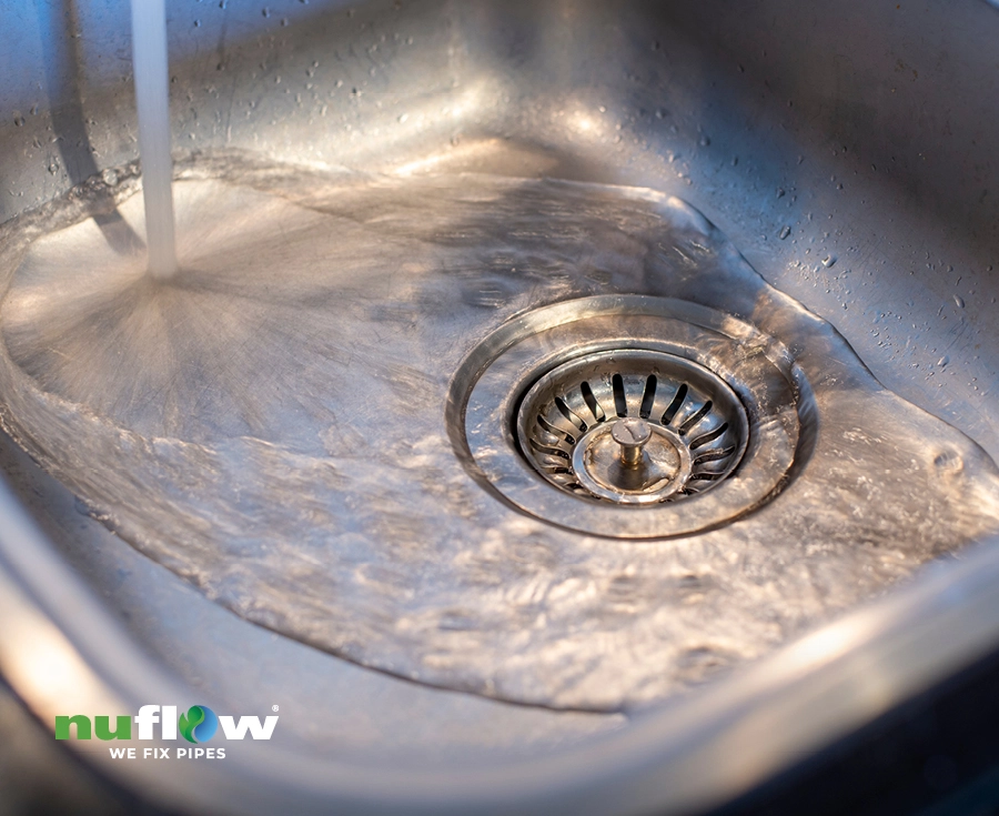 Water drain down on a stainless steel kitchen sink hole